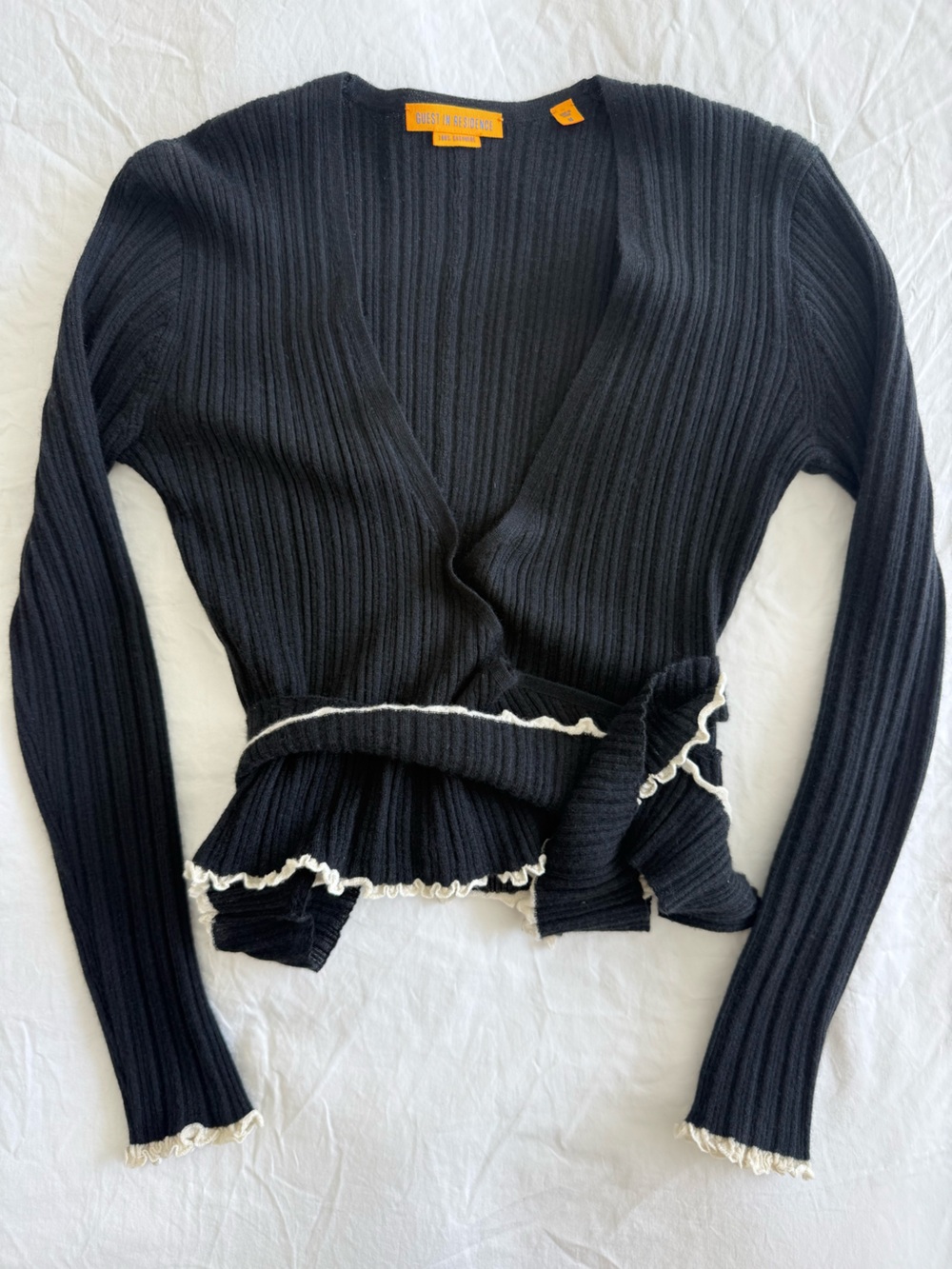 Black Ribbed Knit Sweater with Cream Ruffle Trim